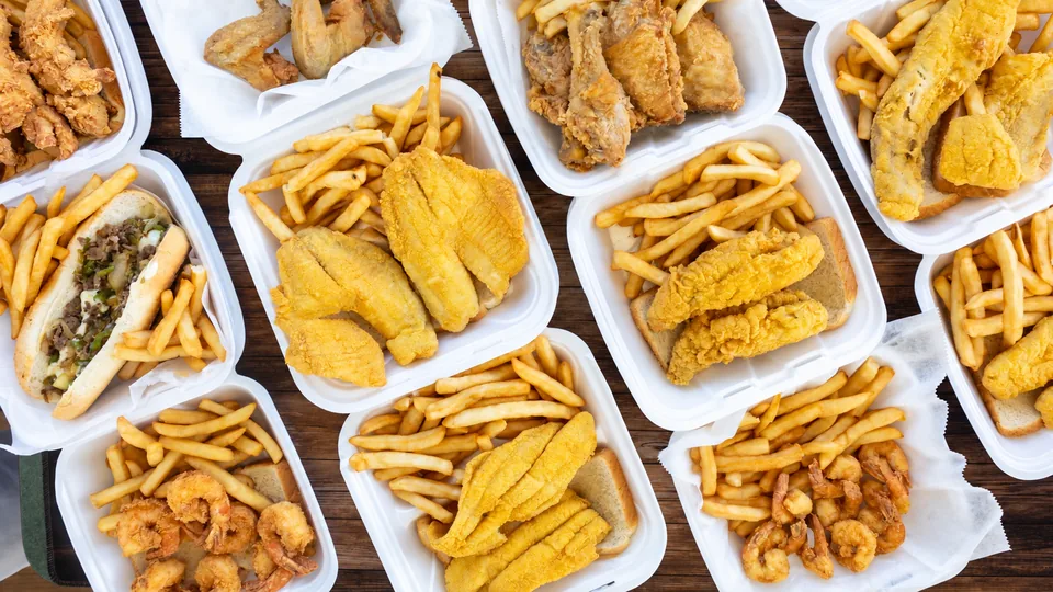 An assortment of fish, chicken, shrimp and sandwich meals with fries